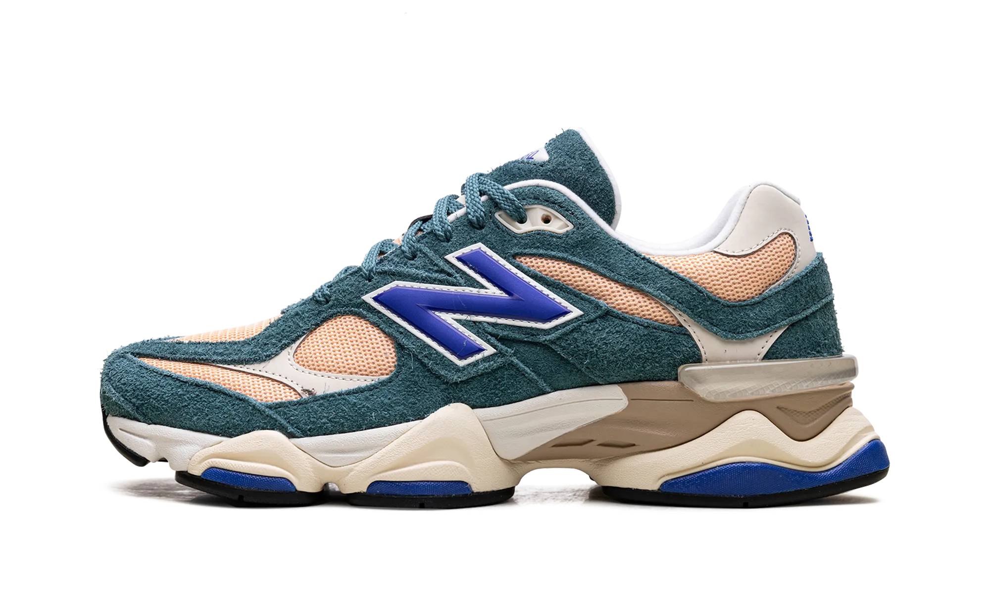 9060 "New Spruce Purple" running in a desert oasis area shoes