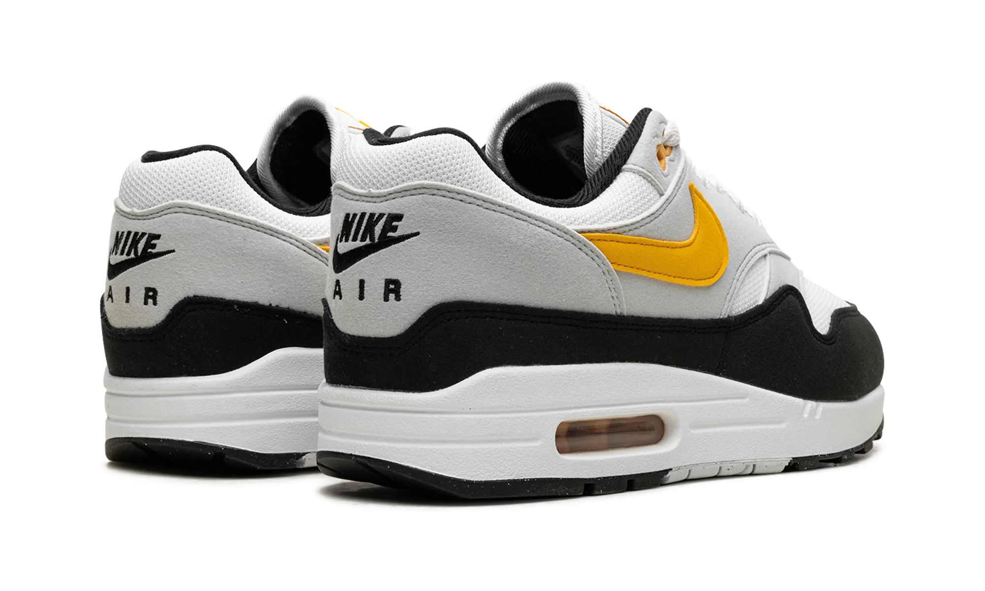 Air Max 1 "White / University Gold / Black" Subtle patterns running in a bridge area shoes