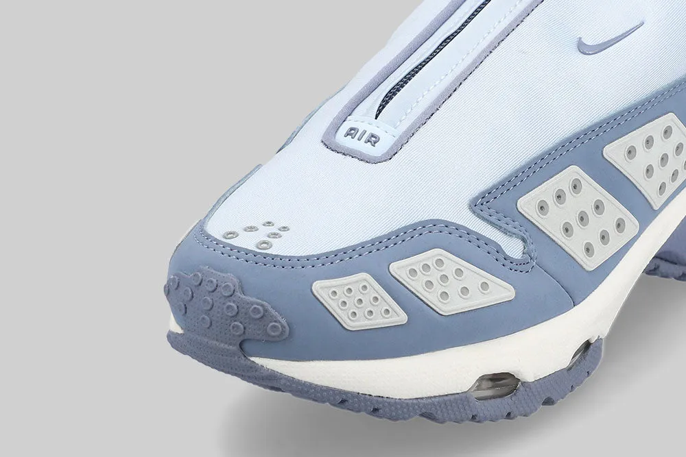 Women's Nike Air Max SNDR 'Blue Tint' platform shoes running in a park trail