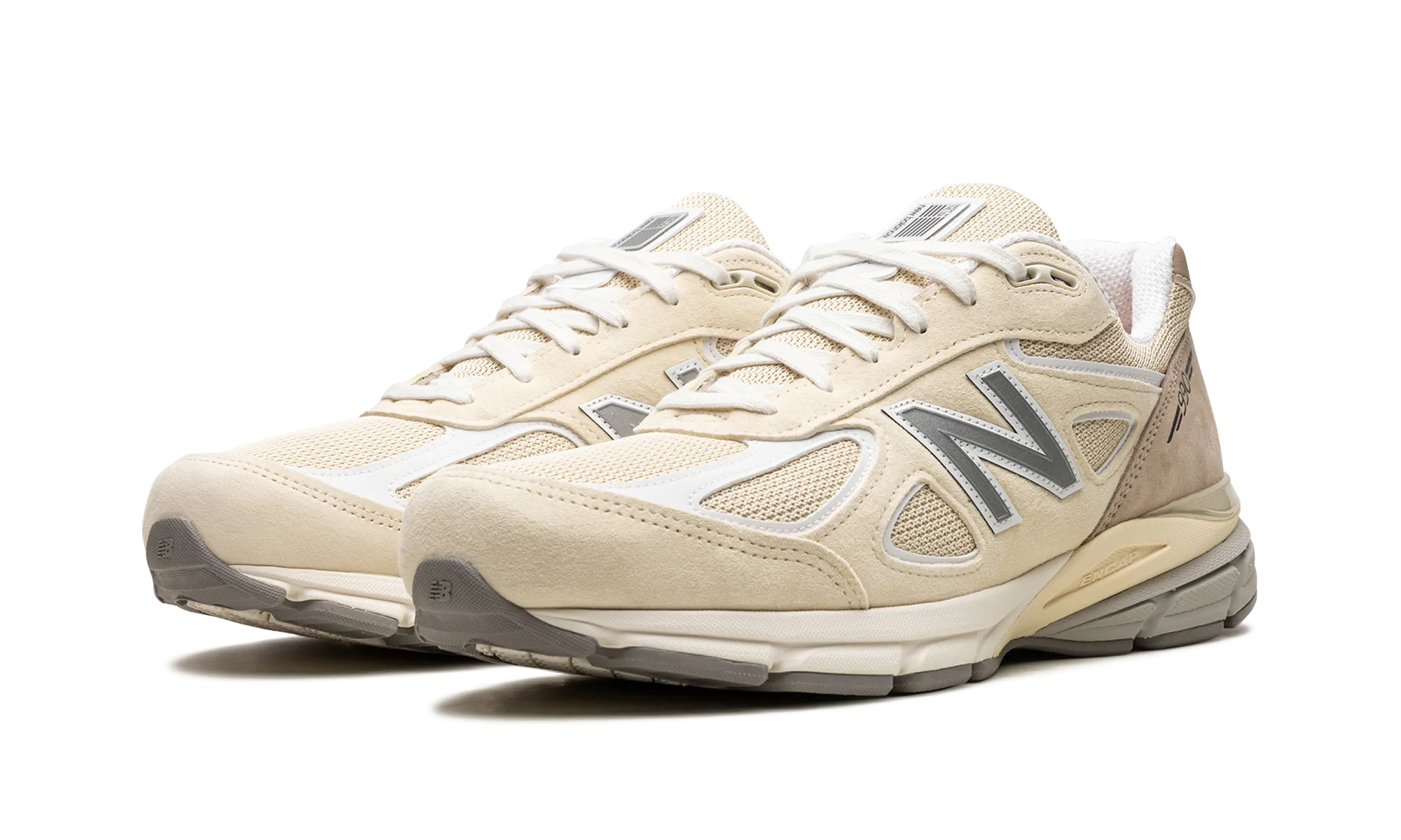 990v4 "Made in USA - Cream" running in a baseball field area shoes