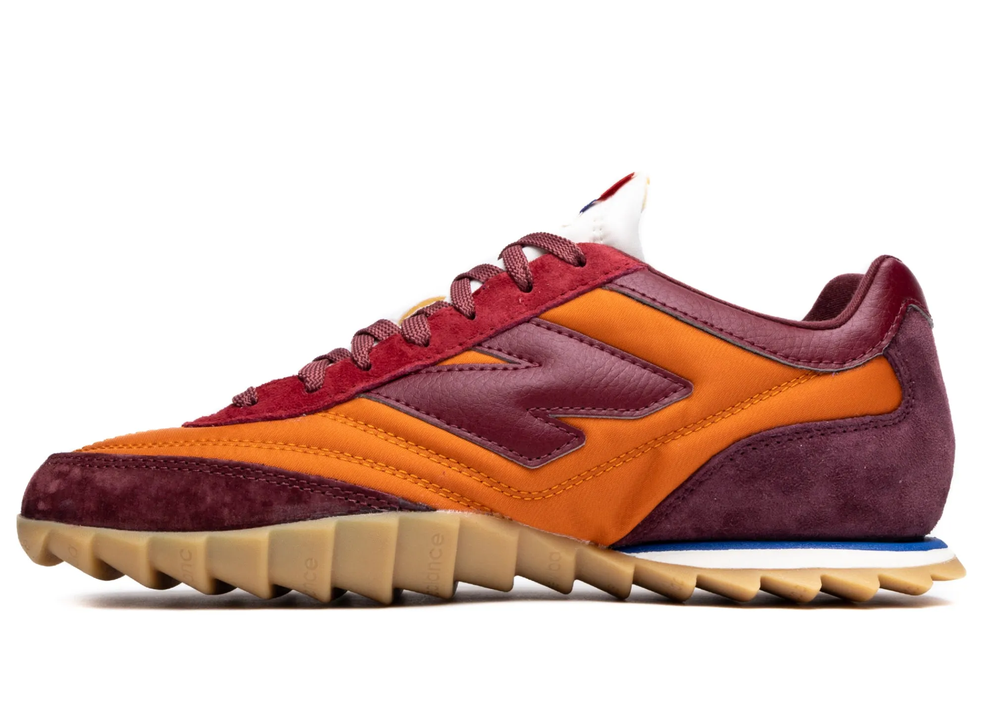Feather Light Travel Enthusiasts Junya Watanabe MAN x New Balance RC30 in Orange and Burgundy