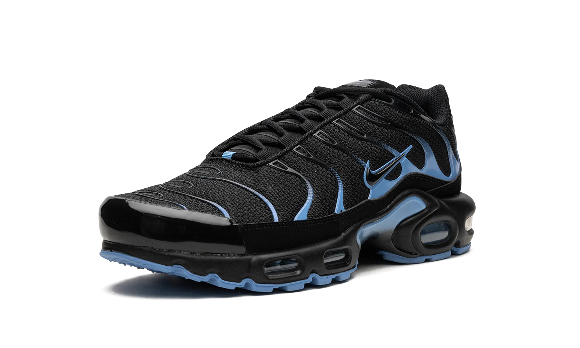 Air Max Plus "Black / University Blue" running in a marsh area shoes
