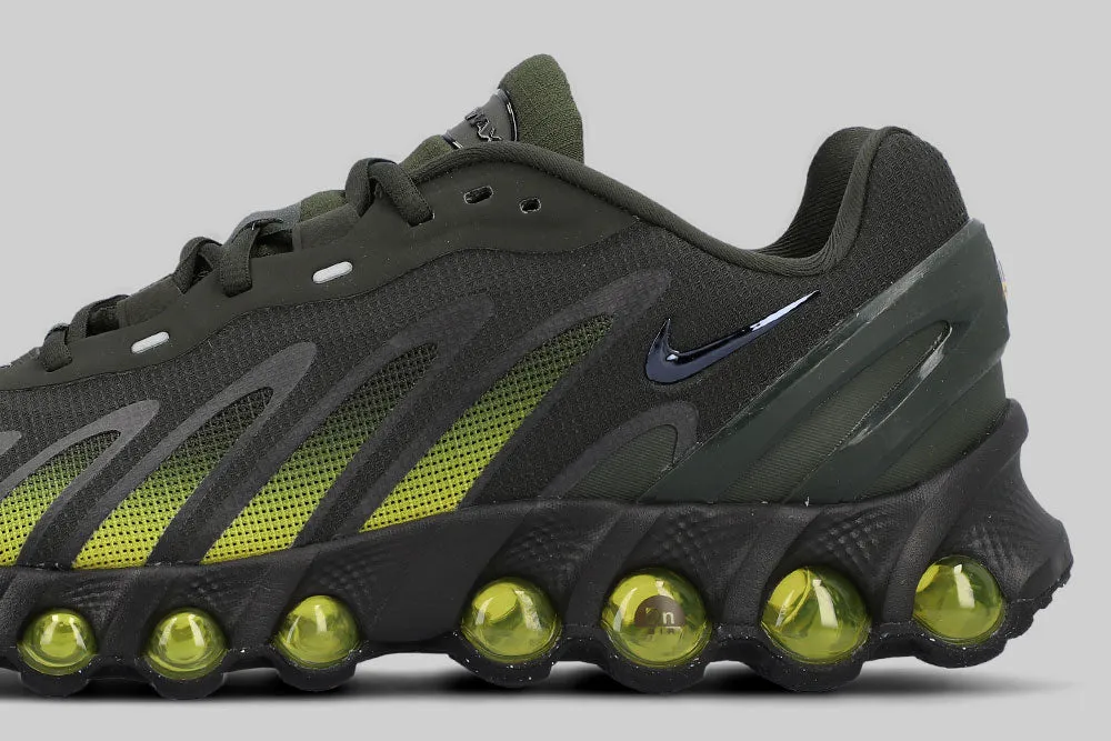 running on a dirt path Core Balance Nike Air Max Dn8 'Sequoia and Bright Citron'