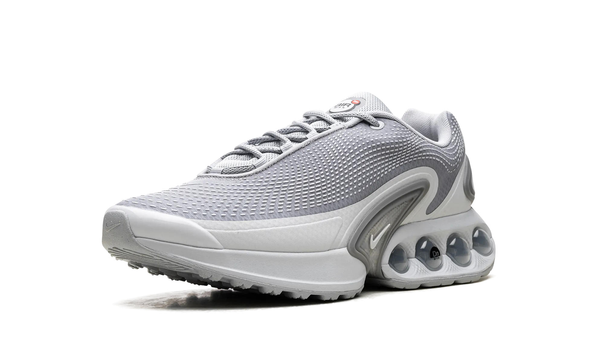 Air Max Dn "Wolf Grey" running on a dirt path lateral - support - stability shoes