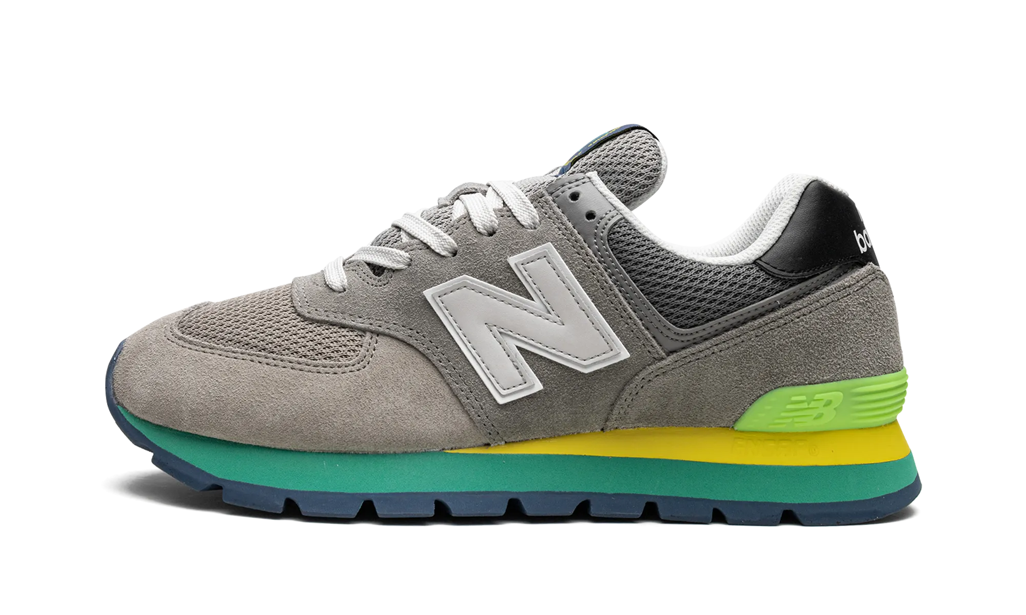 574 Rugged "Rugged Grey Yellow Emerald" running in a marsh area shoes mid - top height
