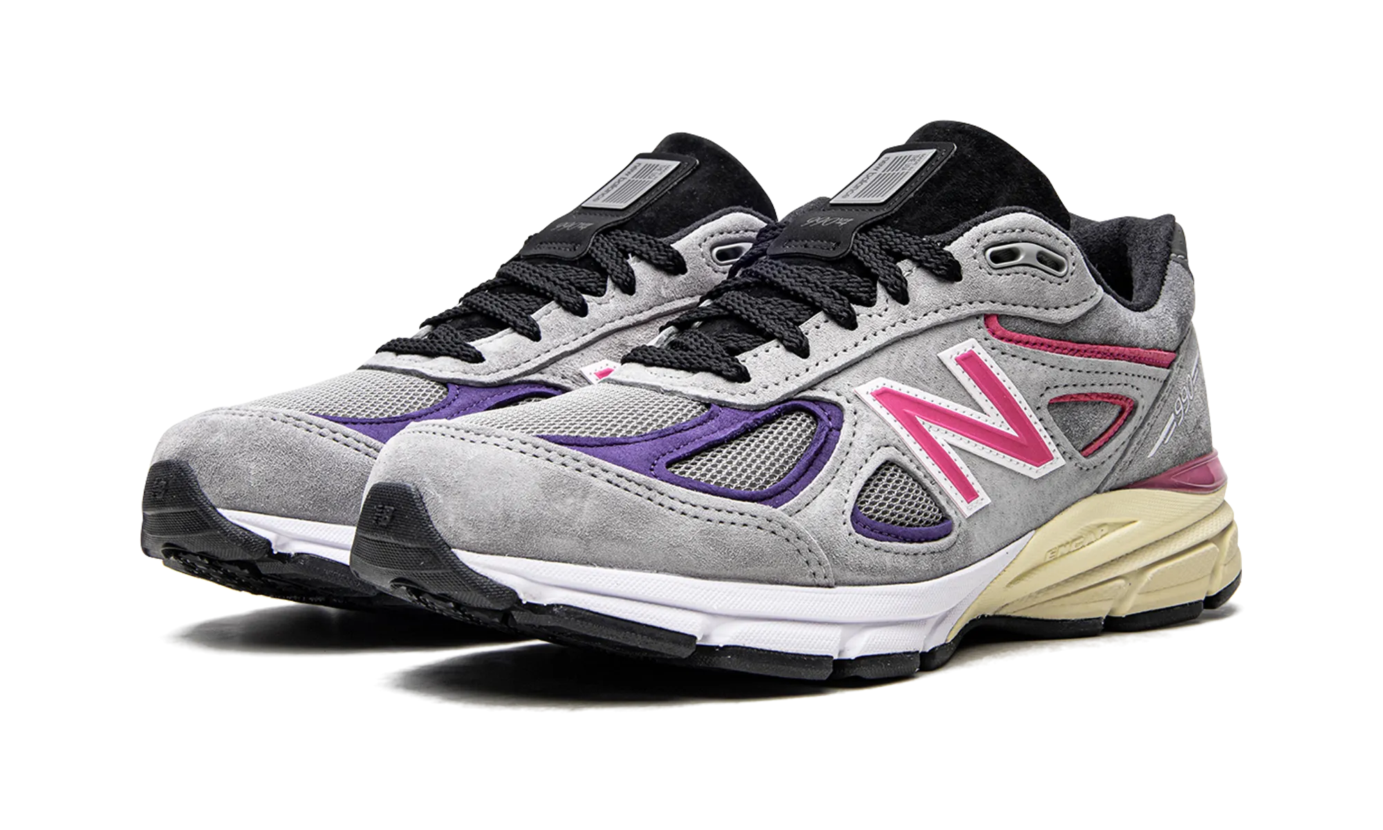 990v4 "Kith United Arrows & Sons" running on an outdoor track shoes